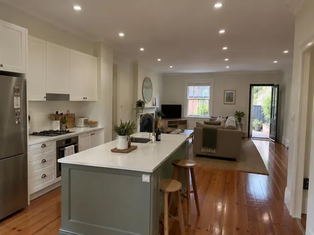 Kitchen and living room with recessed downlights in a modern home interior in Leichhardt